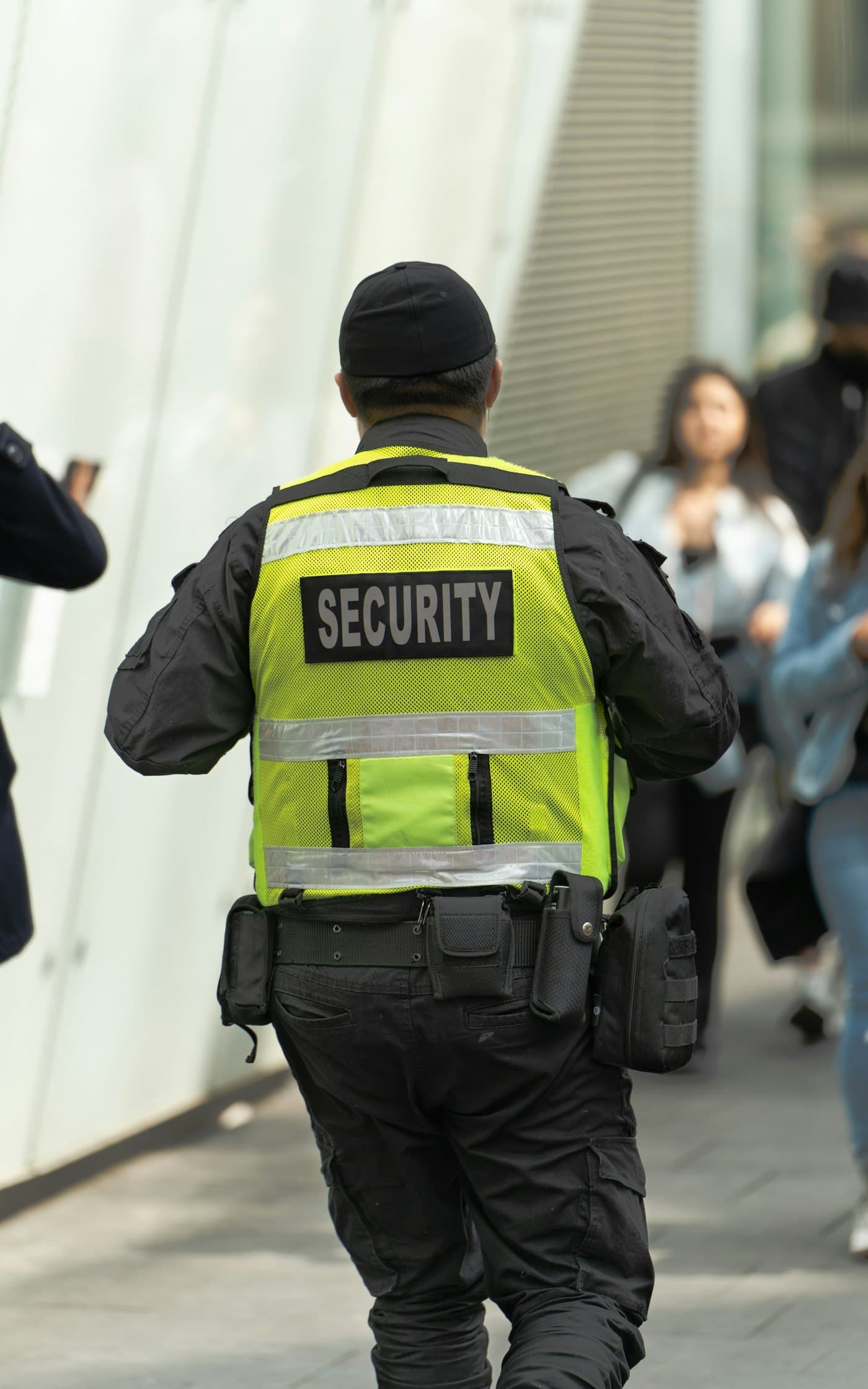 Security officer in a high-visibility vest on patrol